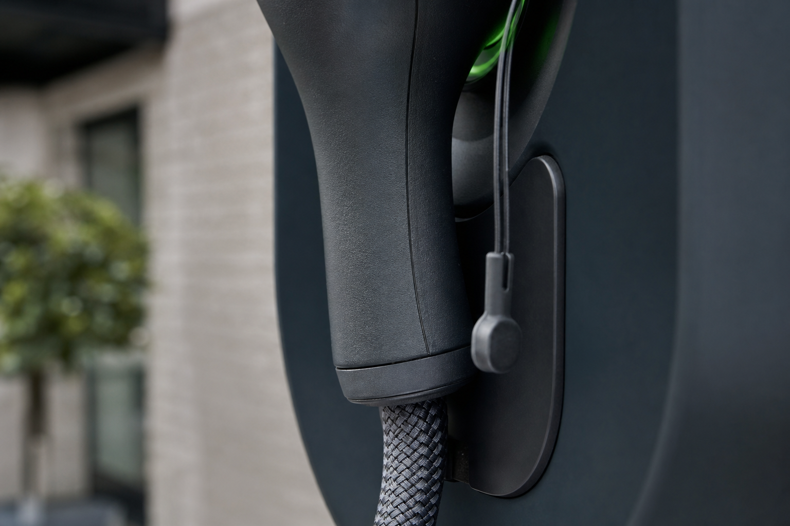 Close detail of tethered EV charging unit and Type 2 connector